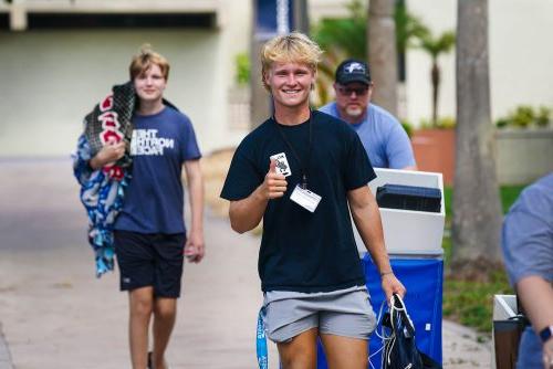 Student gives Thumbs up to camera